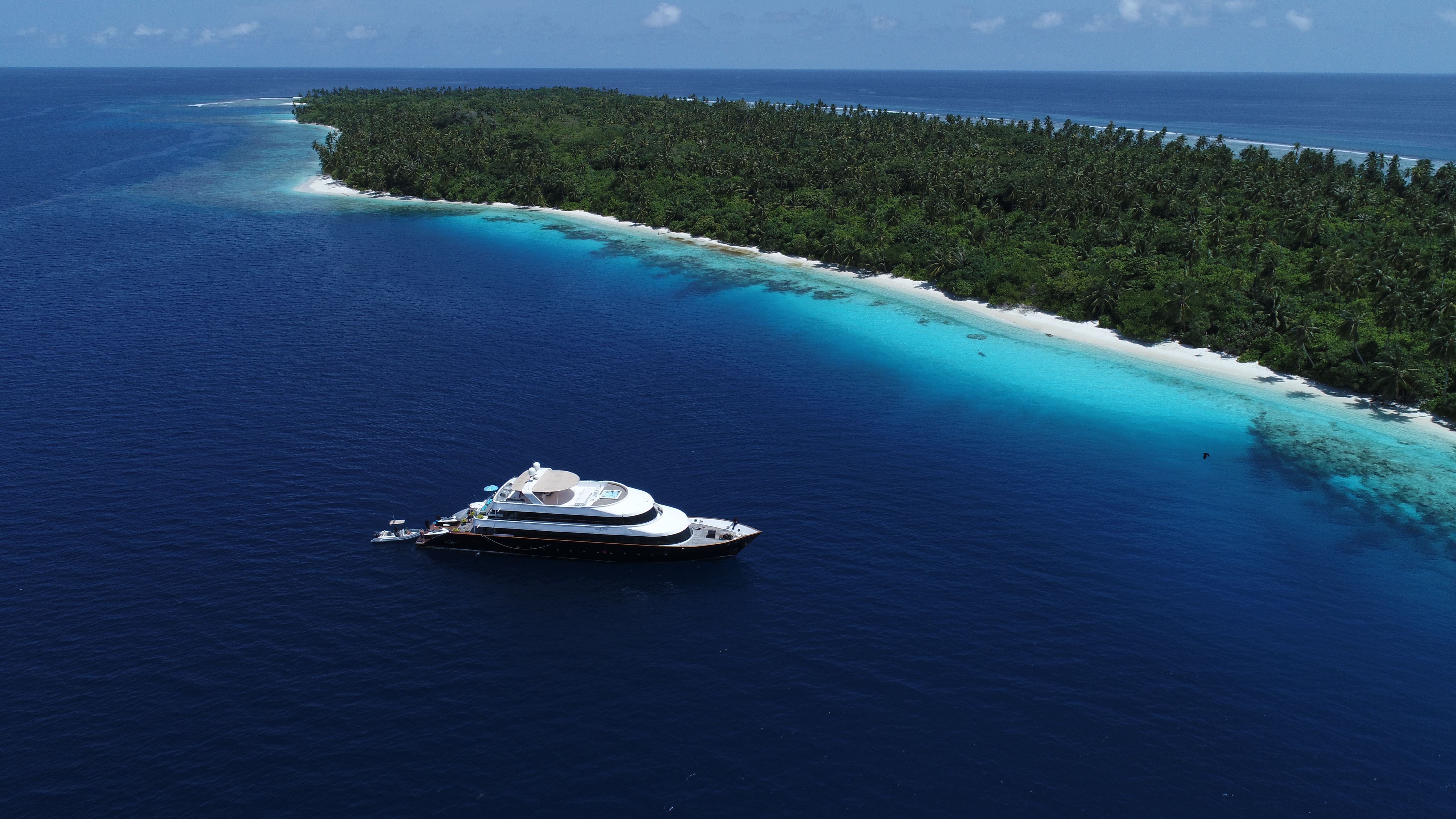 Azalea Cruise 41-metre private superyacht in the Maldives with sea pool, waterslide, water toys and Dhoni support for VIP private charters.
